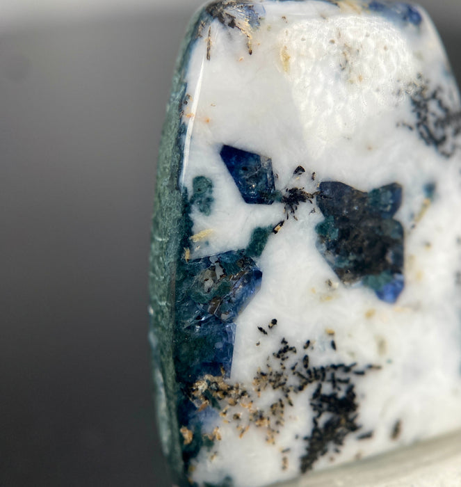 18.79 ct. Rare Benitoite on Natrolite  and Crossite Matrix with Neptunite and Joaquinite Cabochon