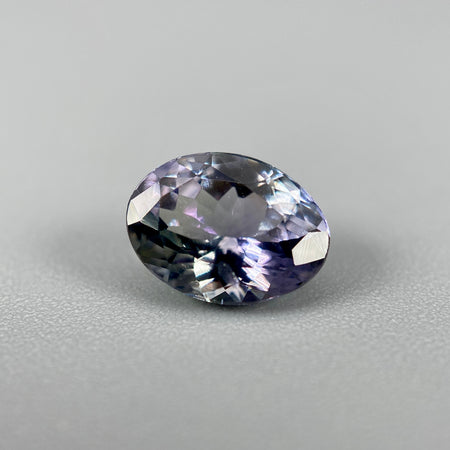 Unheated peacock tanzanite oval gemstone weighing 1.21 carats available on sanctuary of stones dot com photo 1