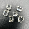 6-piece lot short Burmese phenakite crystals on black background. available at sanctuaryofstones.com