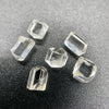 6-piece lot short Burmese phenakite crystals on black background. available at sanctuaryofstones.com