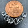 6-piece lot short Burmese phenakite crystals on black background next to one cent piece to show size. available at sanctuaryofstones.com