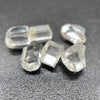6-piece lot of short, fat, stubby Burmese phenakite crystals on black background. available at sanctuaryofstones.com