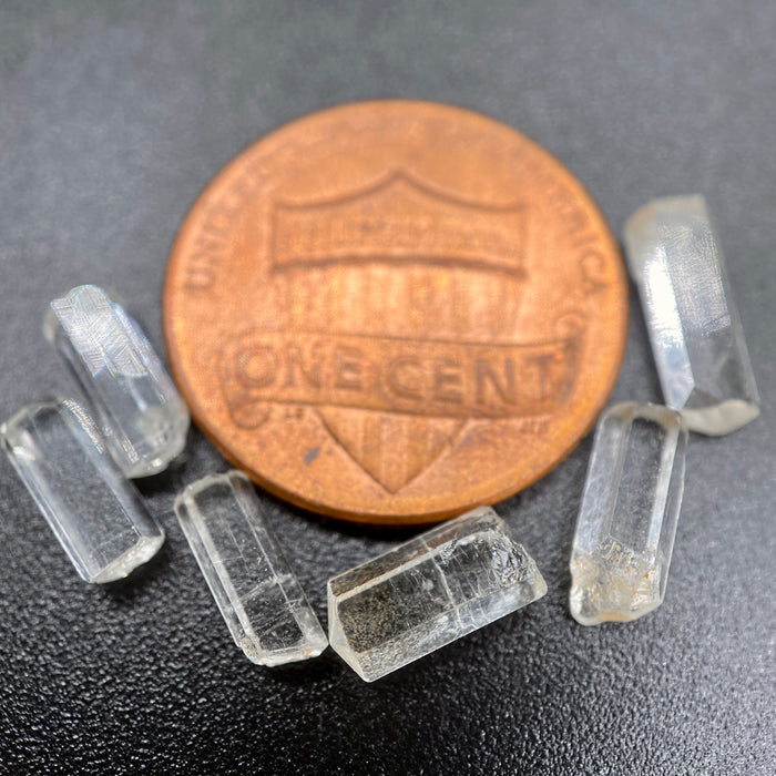 0.78 gram 6-piece lot of crystal clear Burmese phenakite crystals on black background available at sanctuaryofstones.com