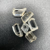 6-piece Burmese phenakite crystal lot on black background | available for sale at sanctuary of stones dot com sanctuaryofstones.com