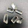 6-piece lot of Burmese phenakite hexagonal barrel crystals that are optically clear on black background available at sanctuary of stones dot com | sanctuaryofstones.com