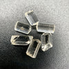 6-piece lot of Burmese phenakite hexagonal barrel crystals that are optically clear on black background available at sanctuary of stones dot com | sanctuaryofstones.com