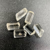 6-piece lot of Burmese phenakite hexagonal barrel crystals that are optically clear on black background available at sanctuary of stones dot com | sanctuaryofstones.com