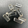 9-piece Burmese phenakite crystal lot on black background. Available at sanctuaryofstones.com
