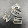 9-piece Burmese phenakite crystal lot on black background. Available at sanctuaryofstones.com