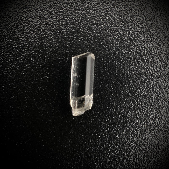 0.23 carat Burmese phenakite drill bit crystal for sale, glass clear, natural termination available at sanctuaryofstones.com photo 1
