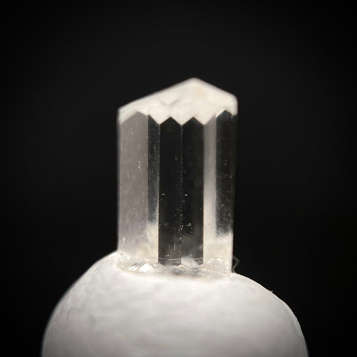 0.50 carat Burmese phenakite drill bit crystal for sale, glass clear, natural termination available at sanctuaryofstones.com photo 1
