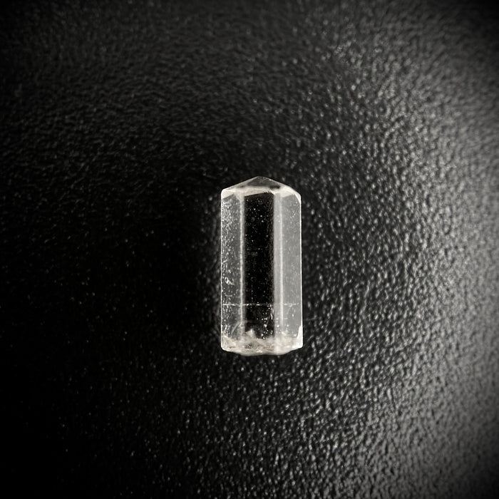 0.55 carat Burmese phenakite drill bit crystal for sale, glass clear, natural termination available at sanctuaryofstones.com photo 1