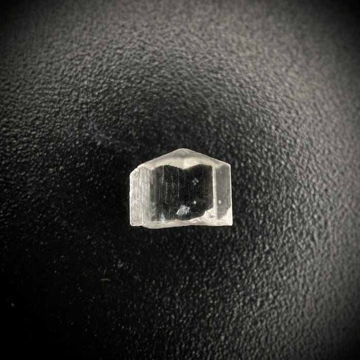 0.56 carat Burmese phenakite drill bit crystal for sale, glass clear, natural termination available at sanctuaryofstones.com photo 1