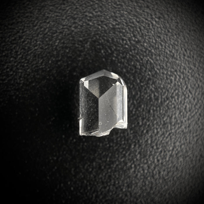0.57 carat Burmese phenakite drill bit crystal for sale, glass clear, natural termination available at sanctuaryofstones.com photo 1