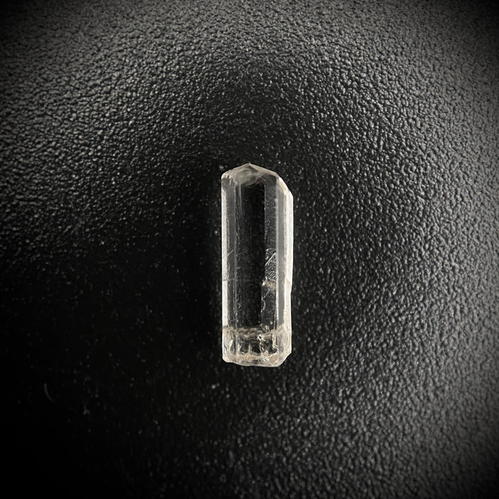 0.57 carat Burmese phenakite drill bit crystal for sale, glass clear, natural termination available at sanctuaryofstones.com photo 1