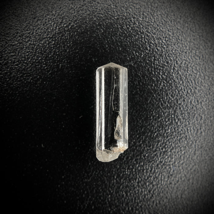 0.57 carat Burmese phenakite drill bit crystal for sale, glass clear, natural termination available at sanctuaryofstones.com photo 1