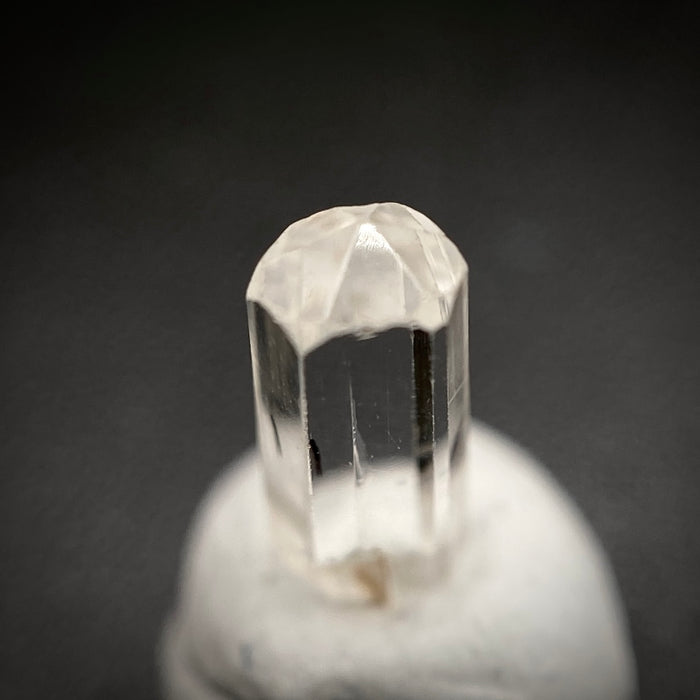 0.58 carat Burmese phenakite drill bit crystal for sale, glass clear, natural termination available at sanctuaryofstones.com photo 7