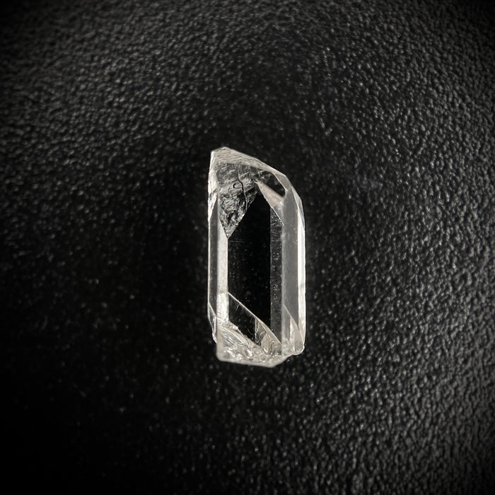 0.585 carat Burmese phenakite drill bit crystal for sale, glass clear, natural termination available at sanctuaryofstones.com photo 1
