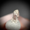 0.585 carat Burmese phenakite drill bit crystal for sale, glass clear, natural termination available at sanctuaryofstones.com photo 3
