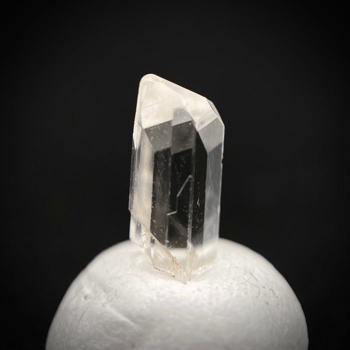 0.585 carat Burmese phenakite drill bit crystal for sale, glass clear, natural termination available at sanctuaryofstones.com photo 9