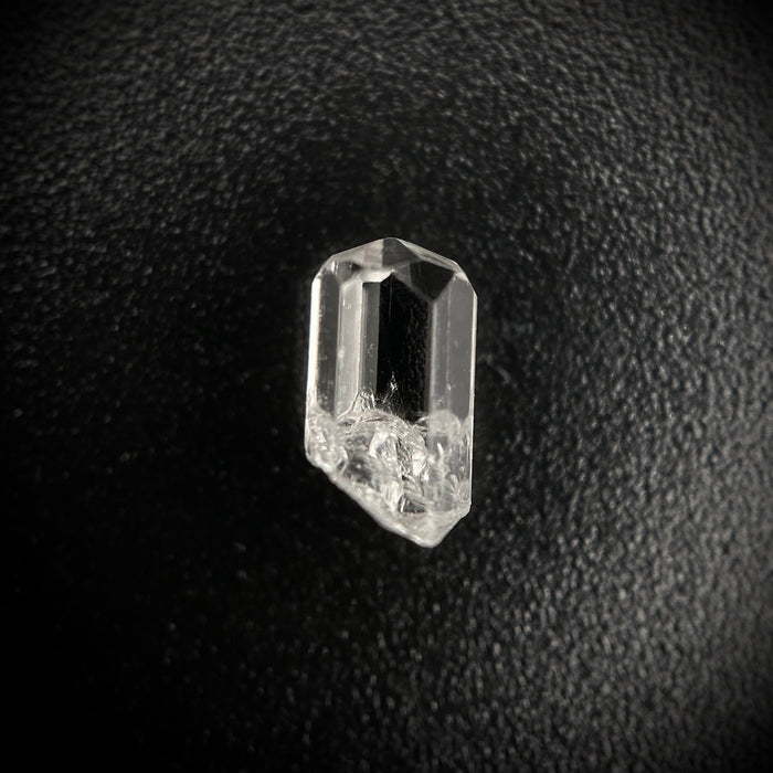 0.59 carat Burmese phenakite drill bit crystal for sale, glass clear, natural termination available at sanctuaryofstones.com photo 1
