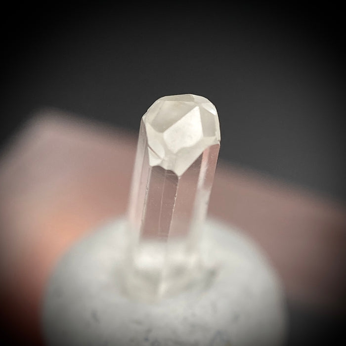 0.595 carat Burmese phenakite drill bit crystal for sale, glass clear, natural termination available at sanctuaryofstones.com photo 1
