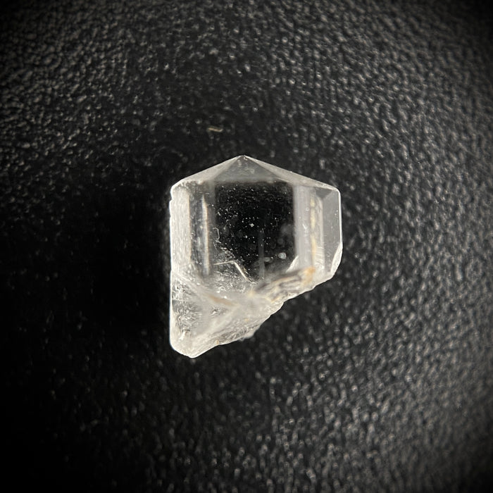 0.615 carat Burmese phenakite drill bit crystal for sale, glass clear, natural termination available at sanctuaryofstones.com photo 1

