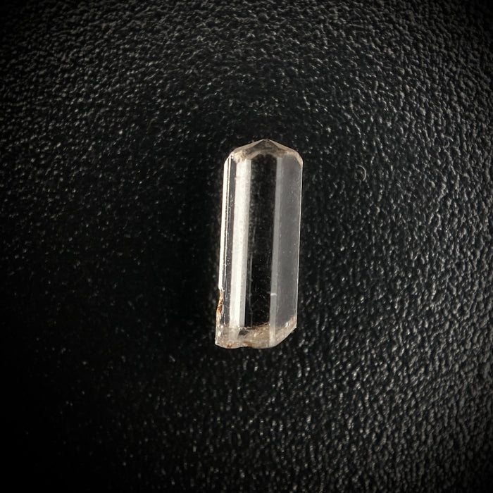 0.25 carat Burmese phenakite drill bit crystal for sale, glass clear, natural termination available at sanctuaryofstones.com photo 1
