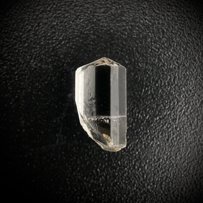 0.705 carat Burmese phenakite drill bit crystal for sale, glass clear, natural termination available at sanctuaryofstones.com photo 1
