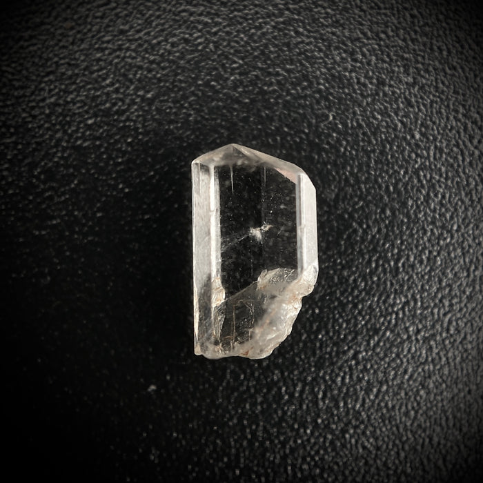 0.725 carat Burmese phenakite drill bit crystal for sale, glass clear, natural termination available at sanctuaryofstones.com photo 1
