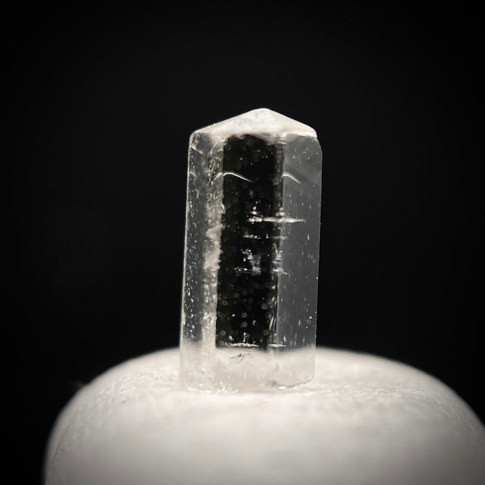 0.27 carat Burmese phenakite drill bit crystal for sale, glass clear, natural termination available at sanctuaryofstones.com photo 1
