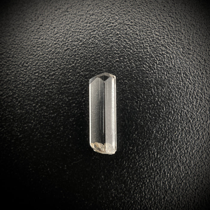 0.355 carat Burmese phenakite drill bit crystal for sale, glass clear, natural termination available at sanctuaryofstones.com photo 1

