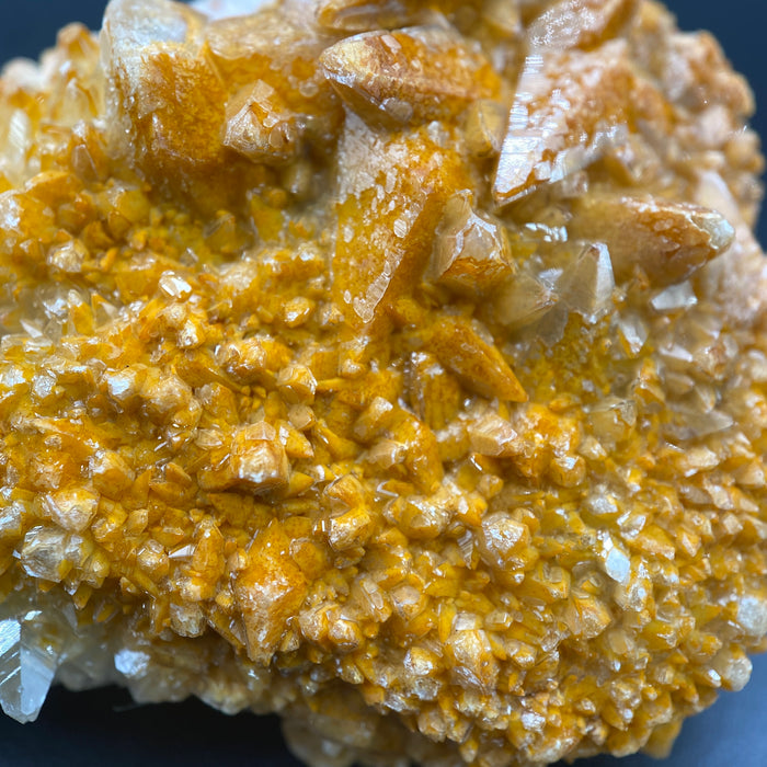 Large Mexican danburite crystal specimen with druzy quartz and golden calcite coating weighing 39.46 grams available on sanctuary of stones dot com photo 6