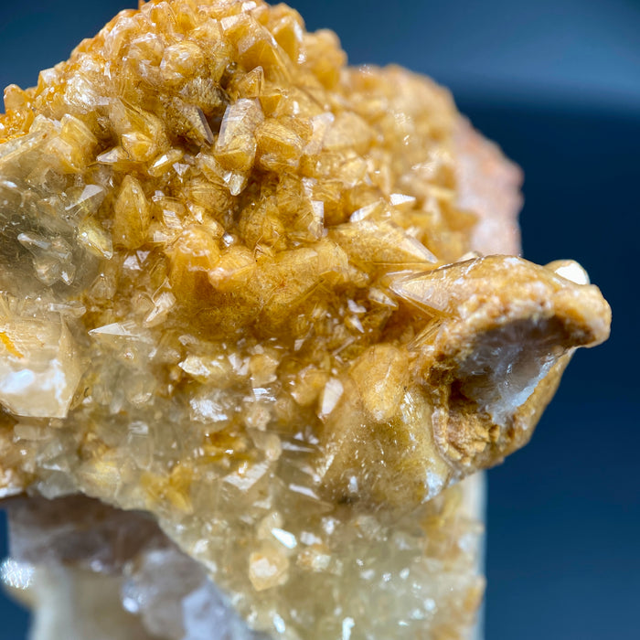 Large Mexican danburite crystal specimen with druzy quartz and golden calcite coating weighing 39.46 grams available on sanctuary of stones dot com photo 8