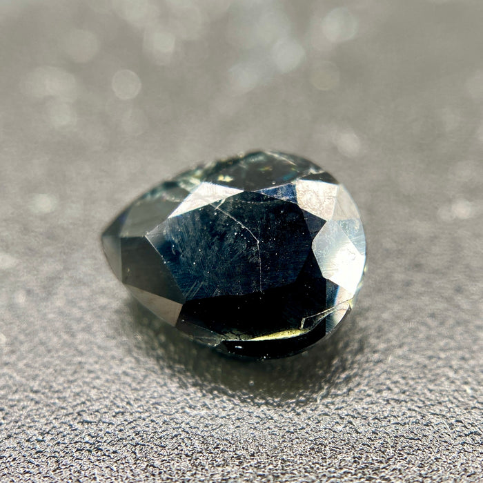 serendibite pear shaped 1.55 carat gemstone, opaque black-blue, very rare gemstone available on sanctuary of stones dot com, sanctuaryofstones.com photo5