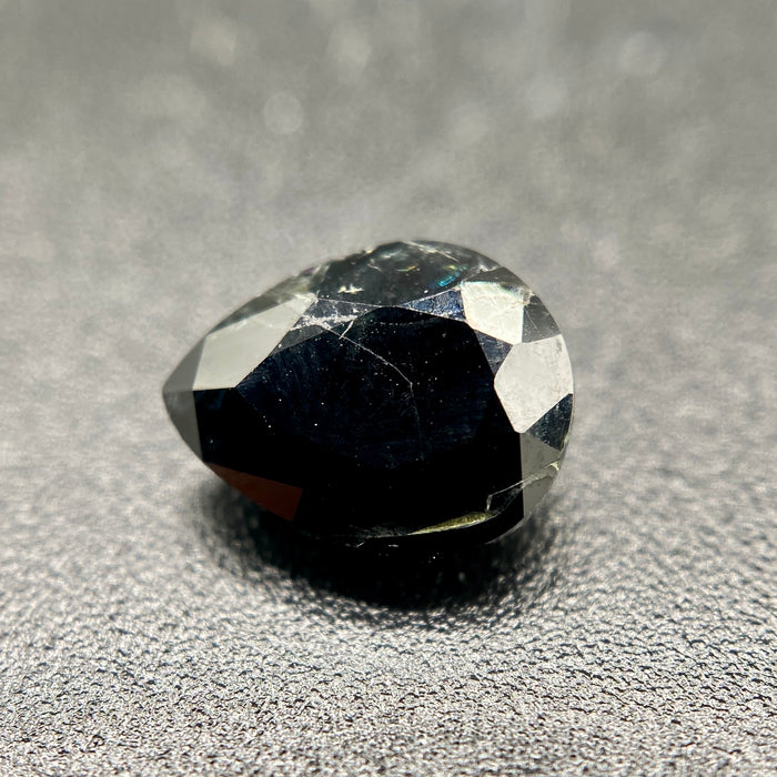 serendibite pear shaped 1.55 carat gemstone, opaque black-blue, very rare gemstone available on sanctuary of stones dot com, sanctuaryofstones.com photo3
