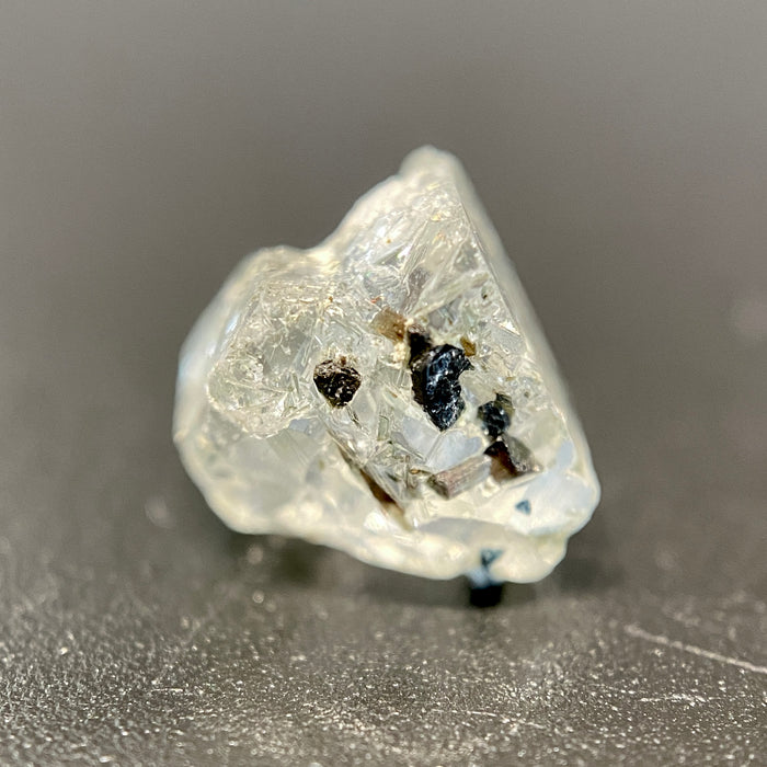 0.81 gram raw Madagascar phenakite crystal with tourmaline inclusions available at sanctuaryofstones.com