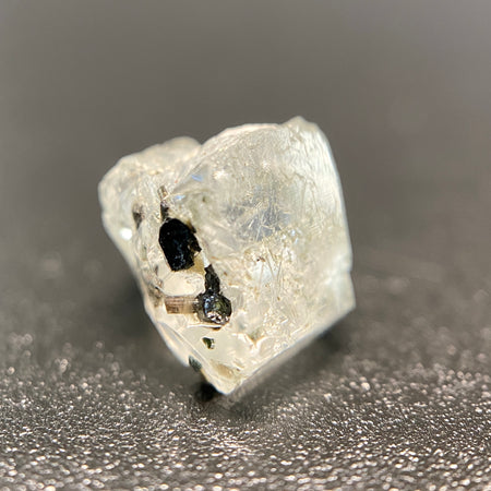 0.81 gram raw Madagascar phenakite crystal with tourmaline inclusions available at sanctuaryofstones.com