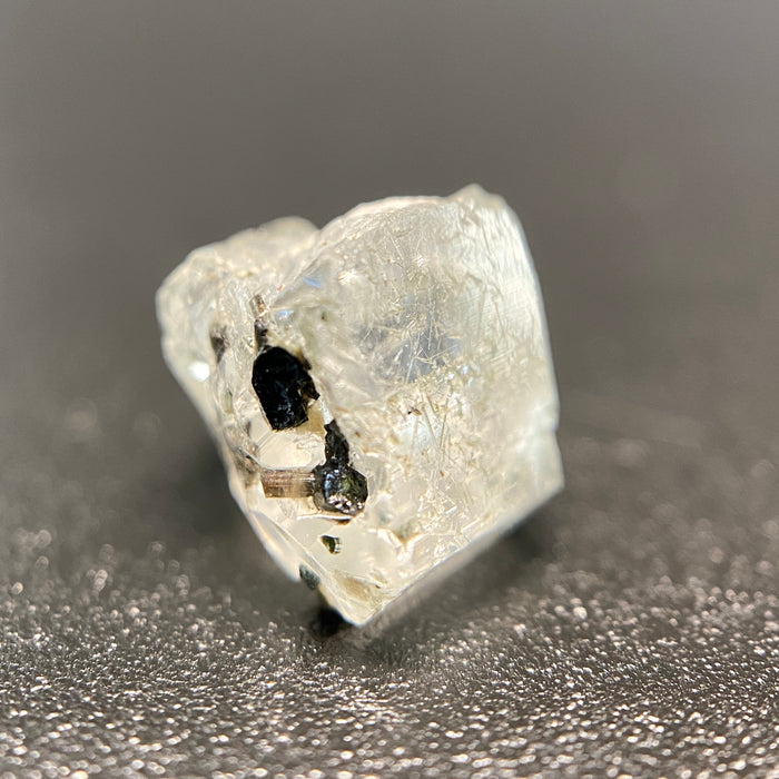0.81 gram raw Madagascar phenakite crystal with tourmaline inclusions available at sanctuaryofstones.com