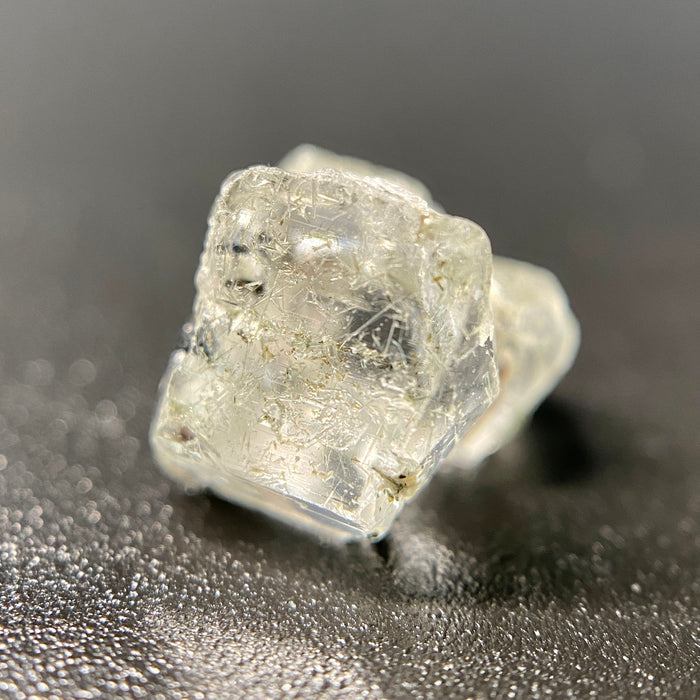 0.81 gram raw Madagascar phenakite crystal with tourmaline inclusions available at sanctuaryofstones.com