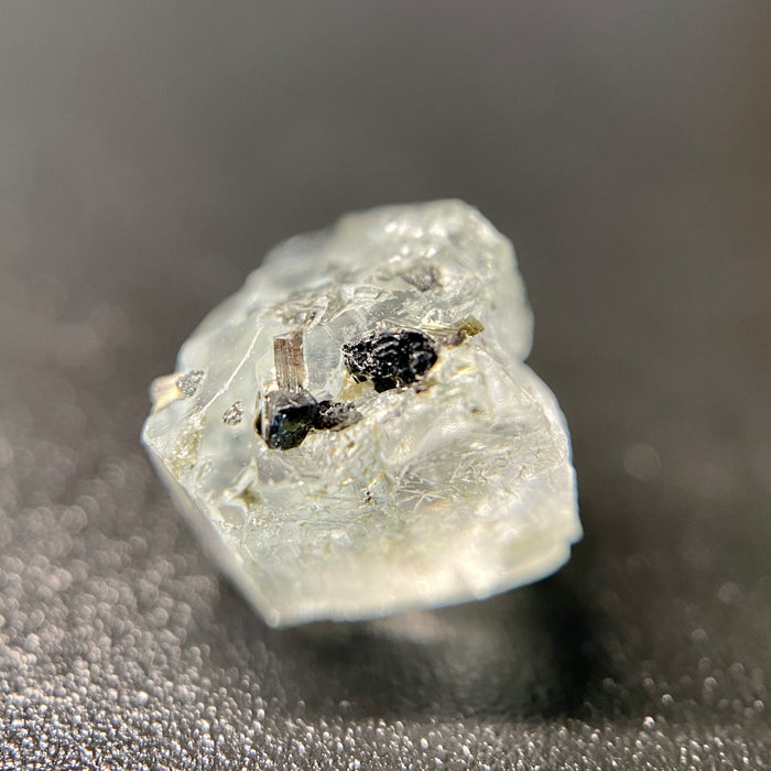 0.81 gram raw Madagascar phenakite crystal with tourmaline inclusions available at sanctuaryofstones.com
