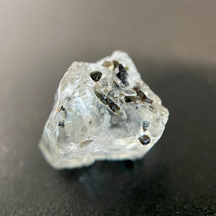 0.81 gram raw Madagascar phenakite crystal with tourmaline inclusions available at sanctuaryofstones.com