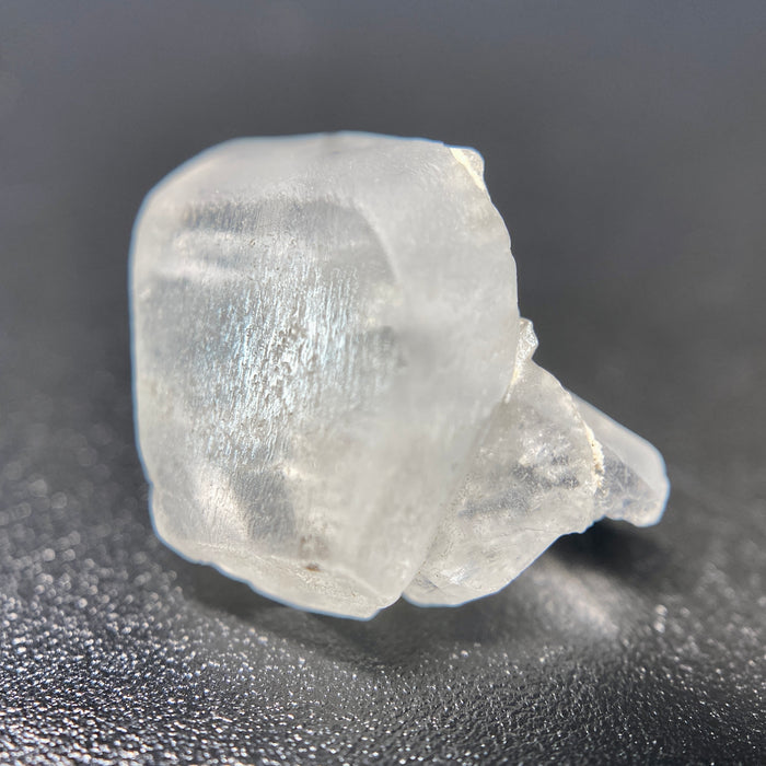 1.80 raw madagascar phenakite crystal with tourmaline inclusions available at sanctuaryofstones.com
