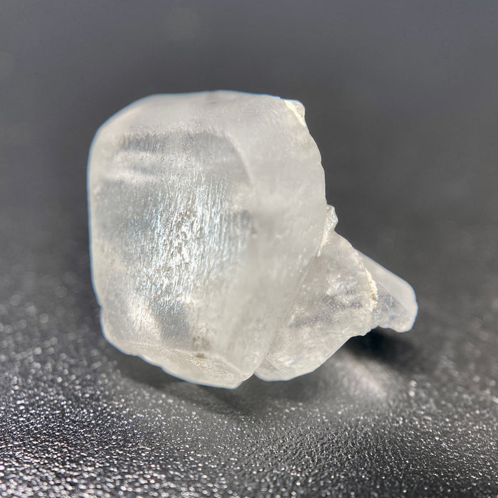 1.80 raw madagascar phenakite crystal with tourmaline inclusions available at sanctuaryofstones.com