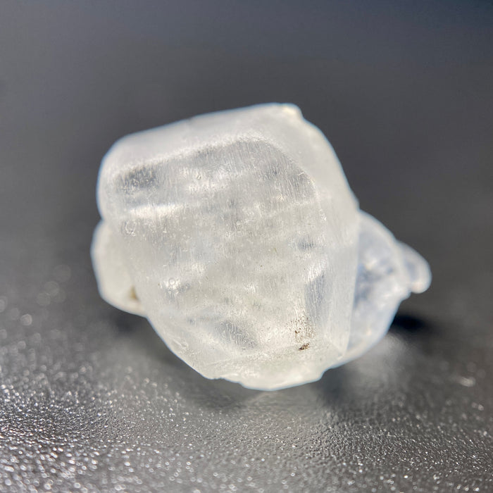 1.80 raw madagascar phenakite crystal with tourmaline inclusions available at sanctuaryofstones.com