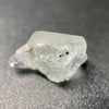 1.80 raw madagascar phenakite crystal with tourmaline inclusions available at sanctuaryofstones.com