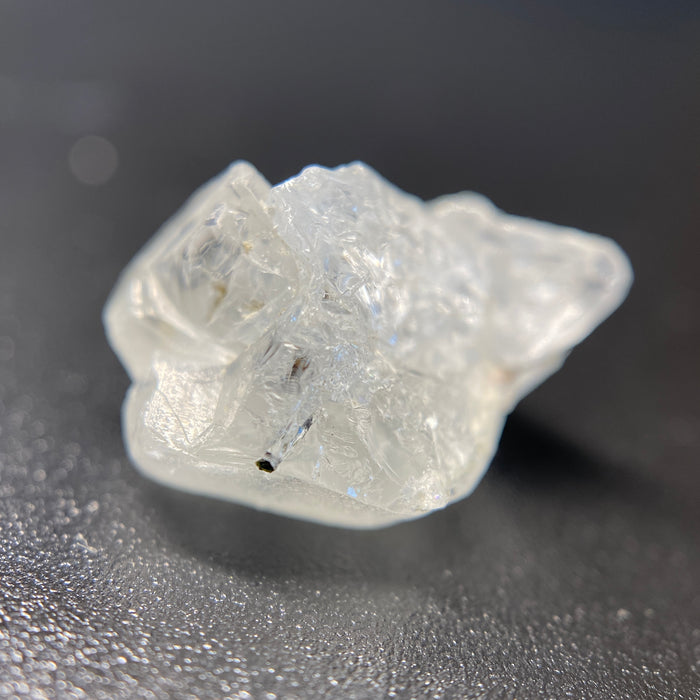 1.80 raw madagascar phenakite crystal with tourmaline inclusions available at sanctuaryofstones.com