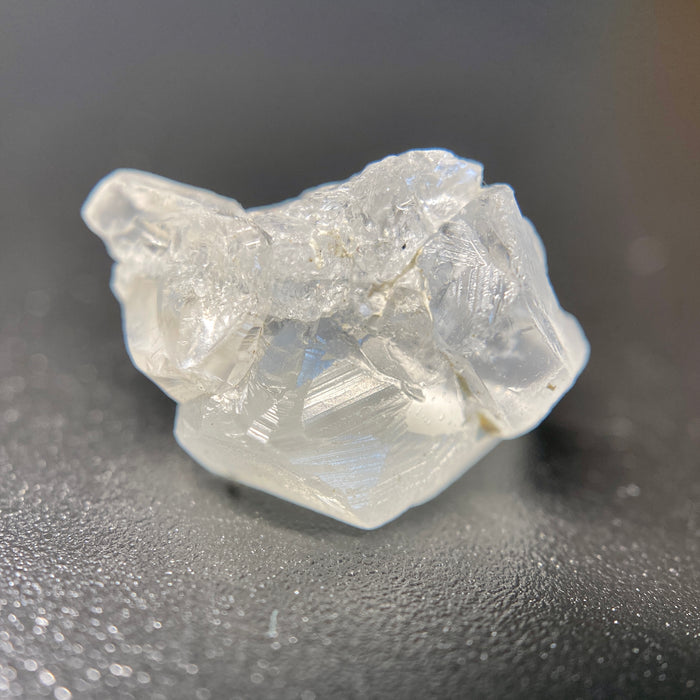 1.80 raw madagascar phenakite crystal with tourmaline inclusions available at sanctuaryofstones.com