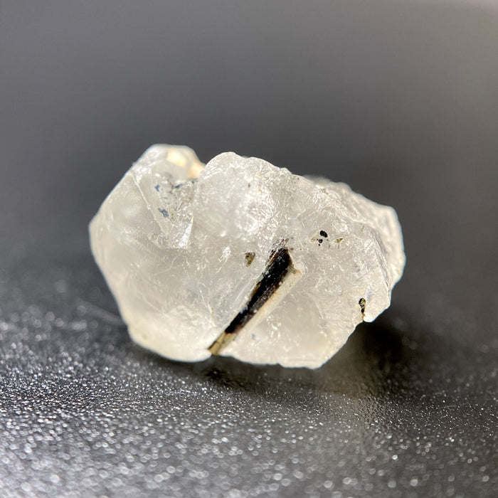 1.95 gram raw Madagascar phenakite crystal with a lot of tourmaline inclusions available at sanctuaryofstones.com
