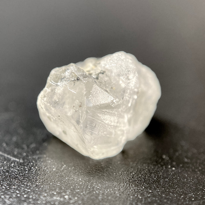 1.95 gram raw Madagascar phenakite crystal with a lot of tourmaline inclusions available at sanctuaryofstones.com